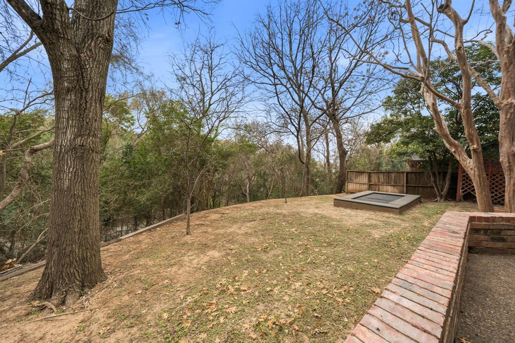 3400 Timbermill Road Waco, TX 76710 - Photo 33 of 35 a backyard of a house with trees and outdoor space