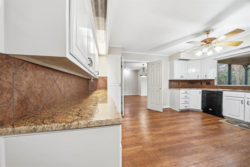 3400 Timbermill Road Waco, TX 76710 - Photo 10 of 35 a view of a kitchen with wooden floor and a window