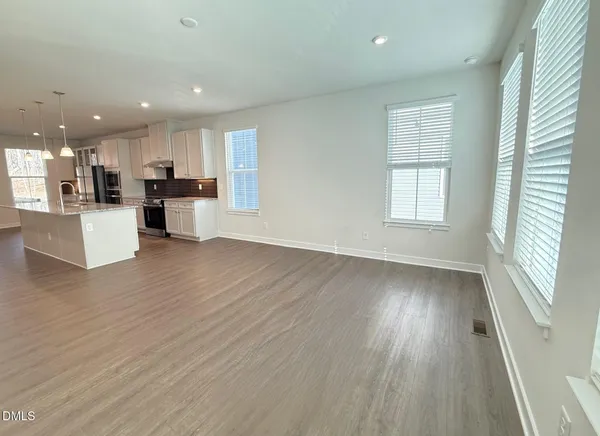 a view of kitchen dining table and wooden floor
