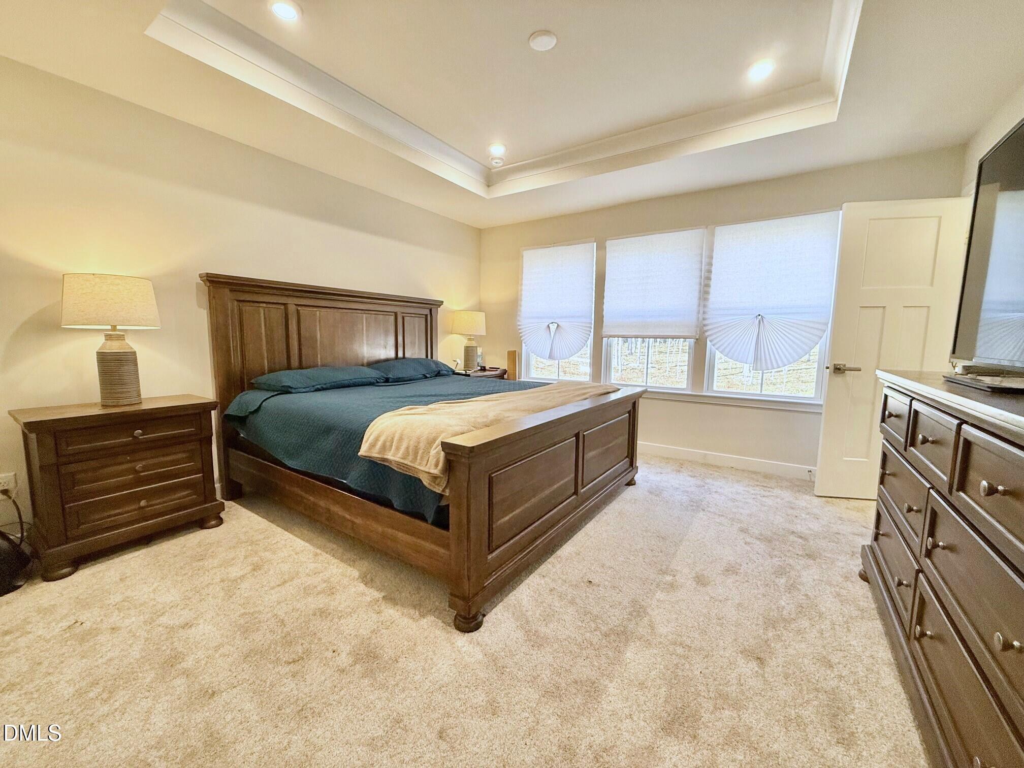 1362 Chowan Avenue Durham, NC 27713 - Photo 12 of 27 a bedroom with a bed and a dresser in it