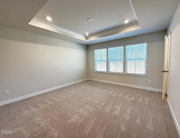 en empty room with windows and closet