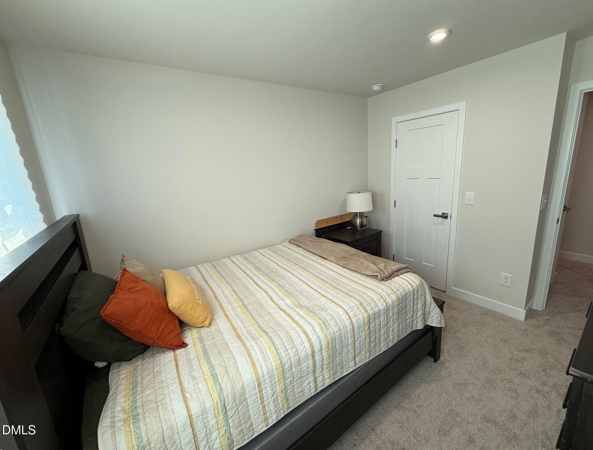 1362 Chowan Avenue Durham, NC 27713 - Photo 18 of 27 a bedroom with a bed and a window