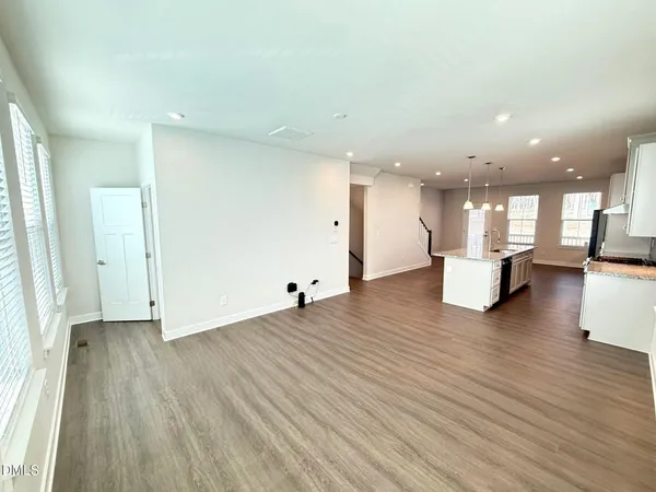 a view of kitchen with furniture and wooden floor