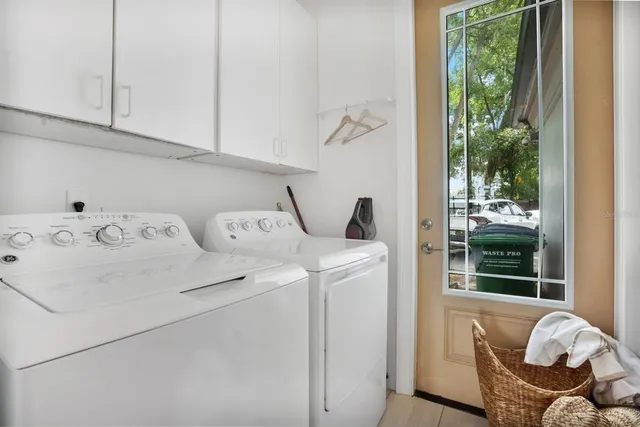 a living room with furniture and a ceiling fan
