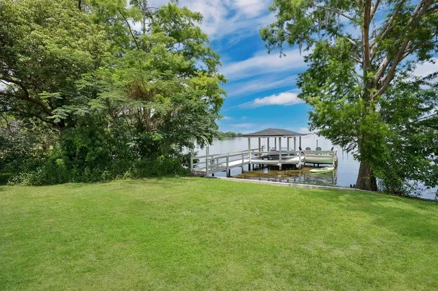a view of a garden with lawn chairs