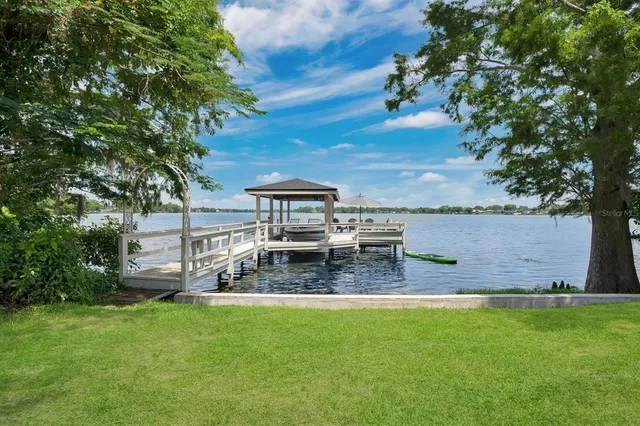 an aerial view of a houses with yard