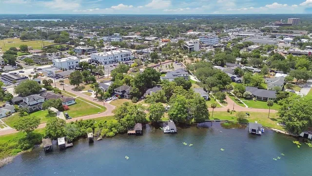 an aerial view of a house with a yard
