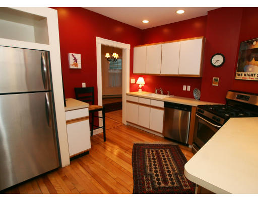 38 Maple Avenue, Unit 1 Cambridge, MA 02139 - Photo 5 of 10 a kitchen view with wooden floor and electronic appliances