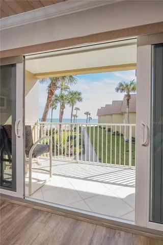 a bedroom with two beds and a chandelier