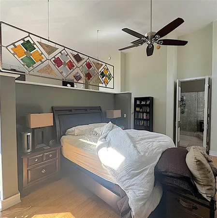 a bedroom with a bed and a dresser