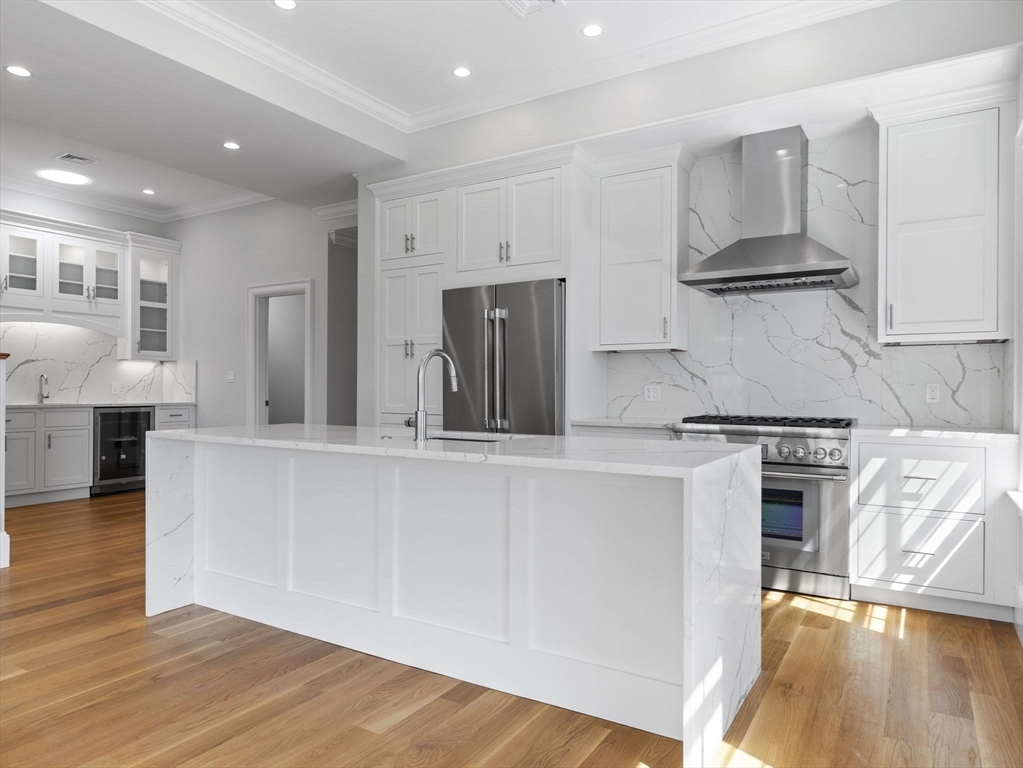 944 East Broadway, Unit 3 Boston, MA 02127 - Photo 1 of 33 a kitchen with stainless steel appliances granite countertop a stove and a refrigerator