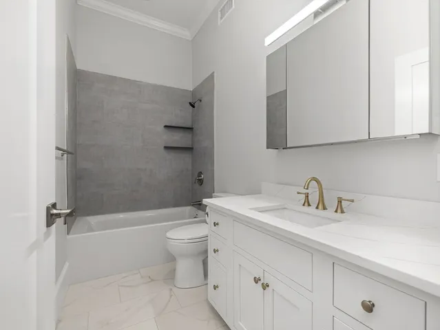 a bathroom with a sink a toilet and a bathtub