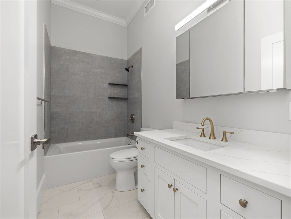944 East Broadway, Unit 3 Boston, MA 02127 - Photo 13 of 33 a bathroom with a sink a toilet and a bathtub