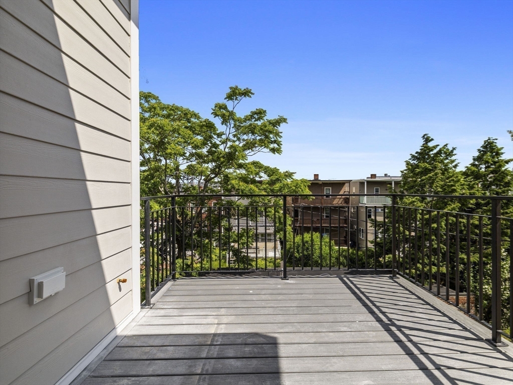 944 East Broadway, Unit 3 Boston, MA 02127 - Photo 16 of 33 a view of balcony with wooden floor and city view