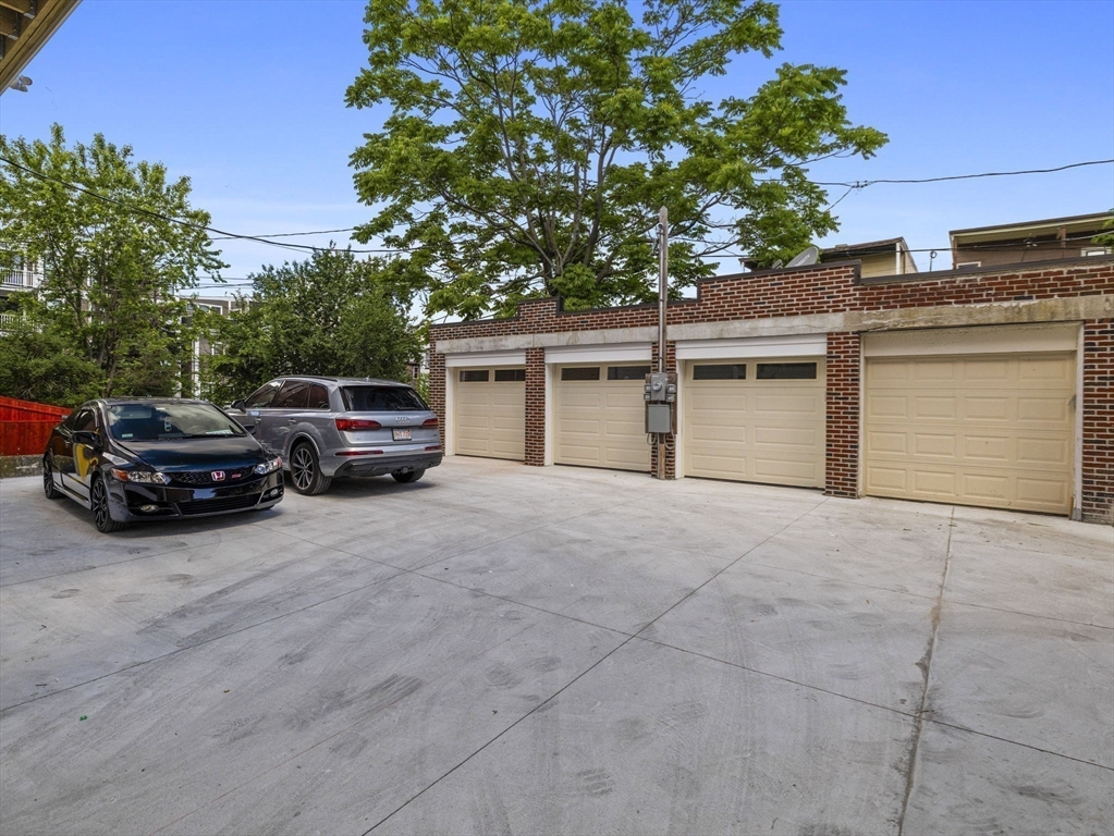 944 East Broadway, Unit 3 Boston, MA 02127 - Photo 24 of 33 a car parked in front of house