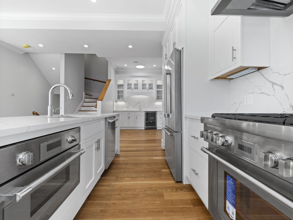 944 East Broadway, Unit 3 Boston, MA 02127 - Photo 4 of 33 a large kitchen with a stove and a sink