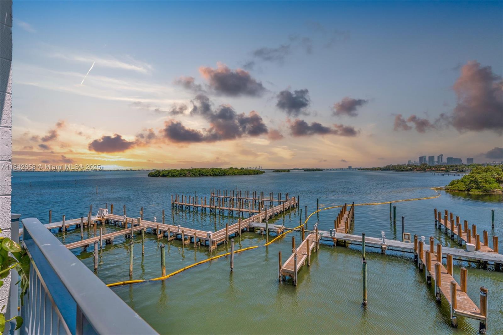 770 Northeast 69th Street, Unit 4H Miami, FL 33138 - Photo 3 of 18 a view of a balcony with chairs