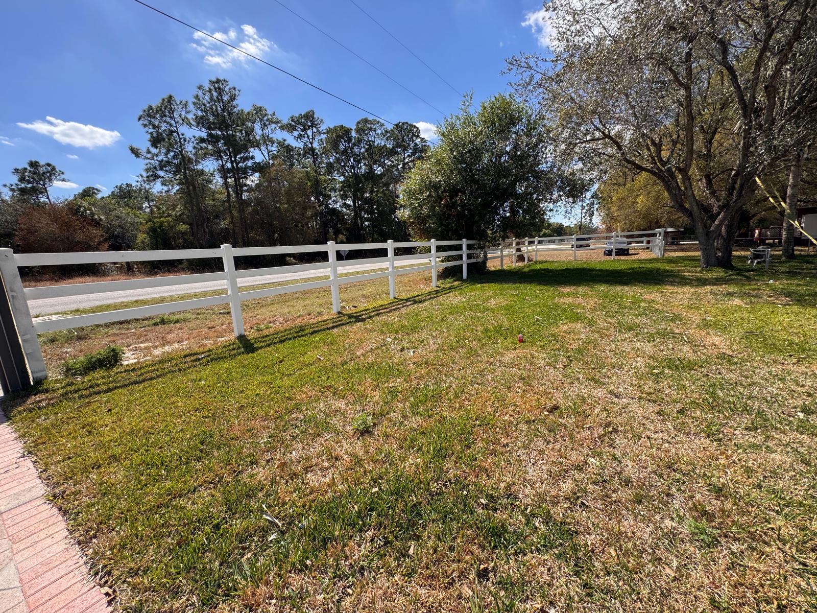 357 Hunting Club Avenue Clewiston, FL 33440 - Photo 23 of 37 a view of a swimming pool with an outdoor space