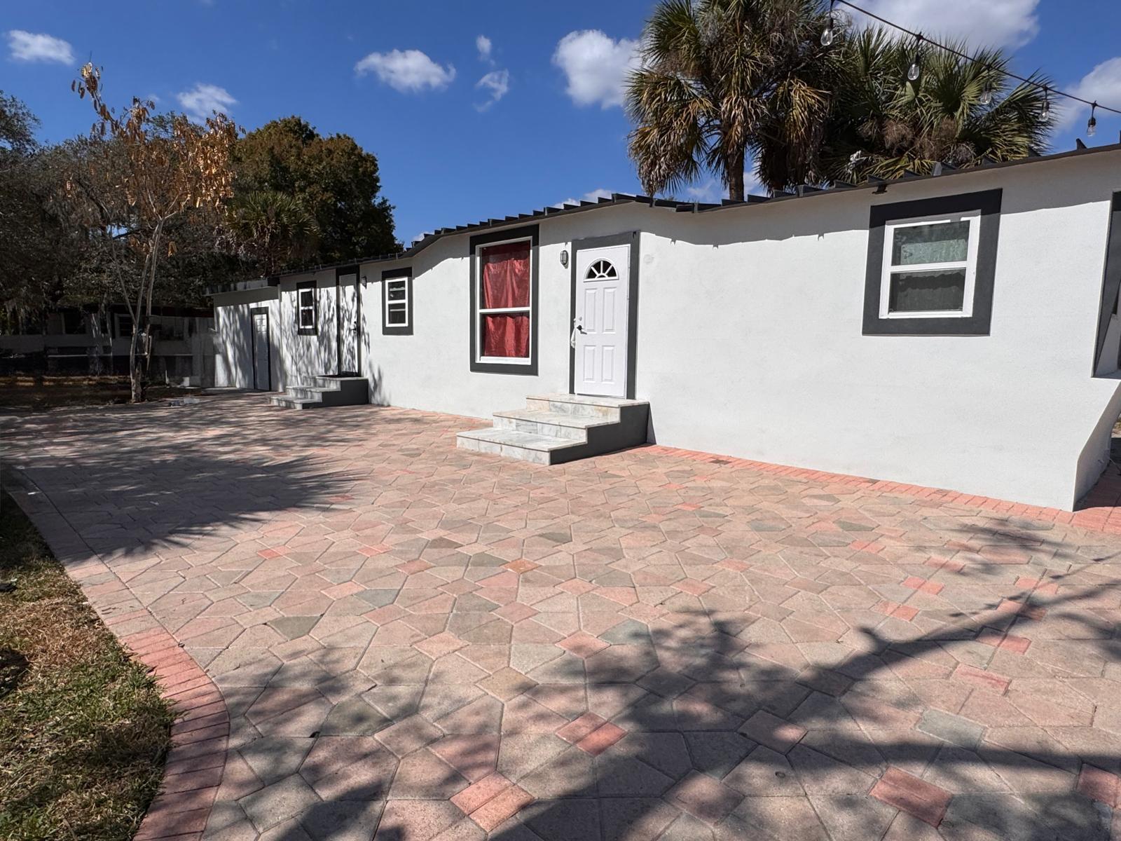 357 Hunting Club Avenue Clewiston, FL 33440 - Photo 26 of 37 a view of a house with a snow in the background