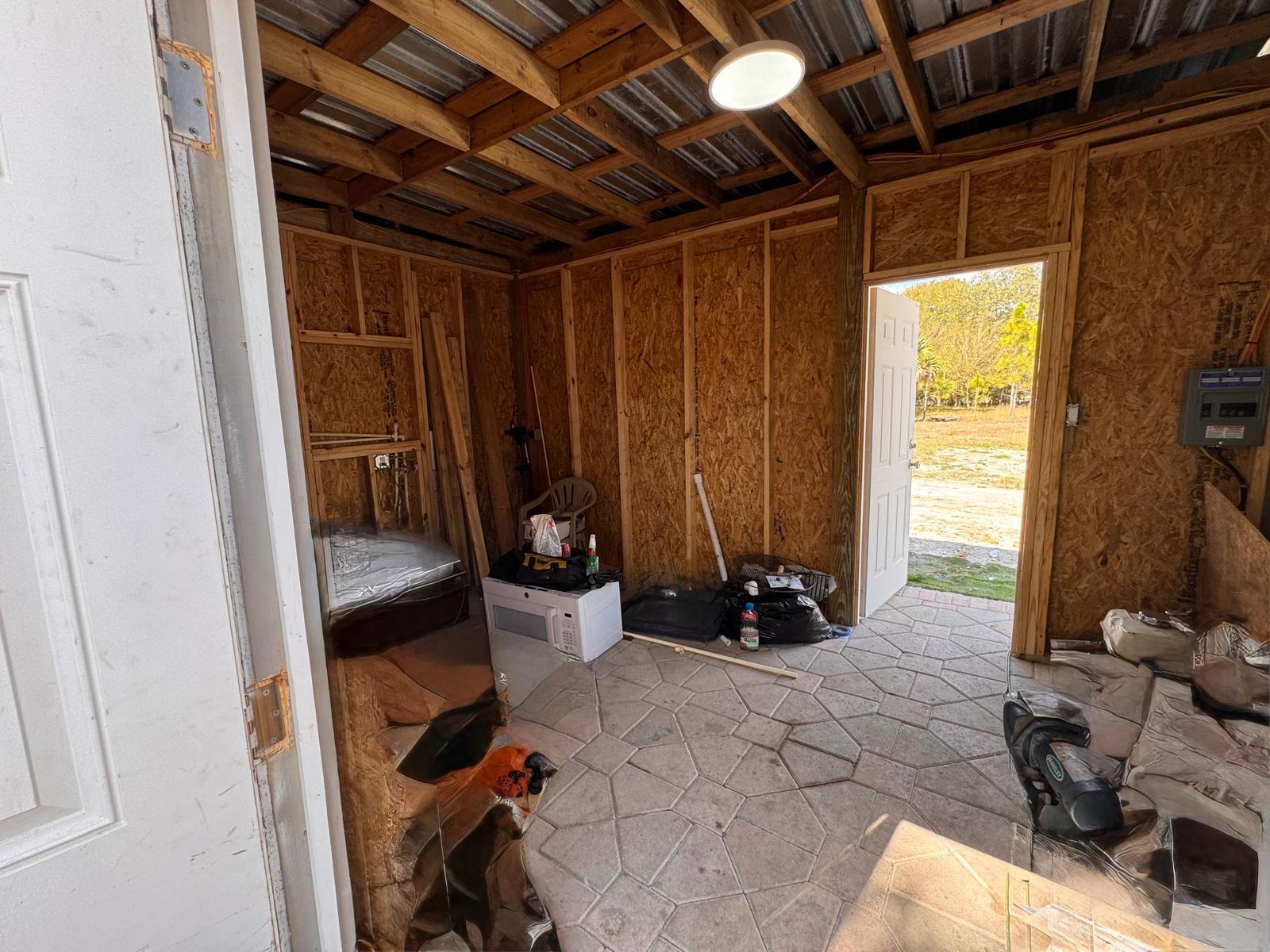 357 Hunting Club Avenue Clewiston, FL 33440 - Photo 30 of 37 a bed room with a bed and a window