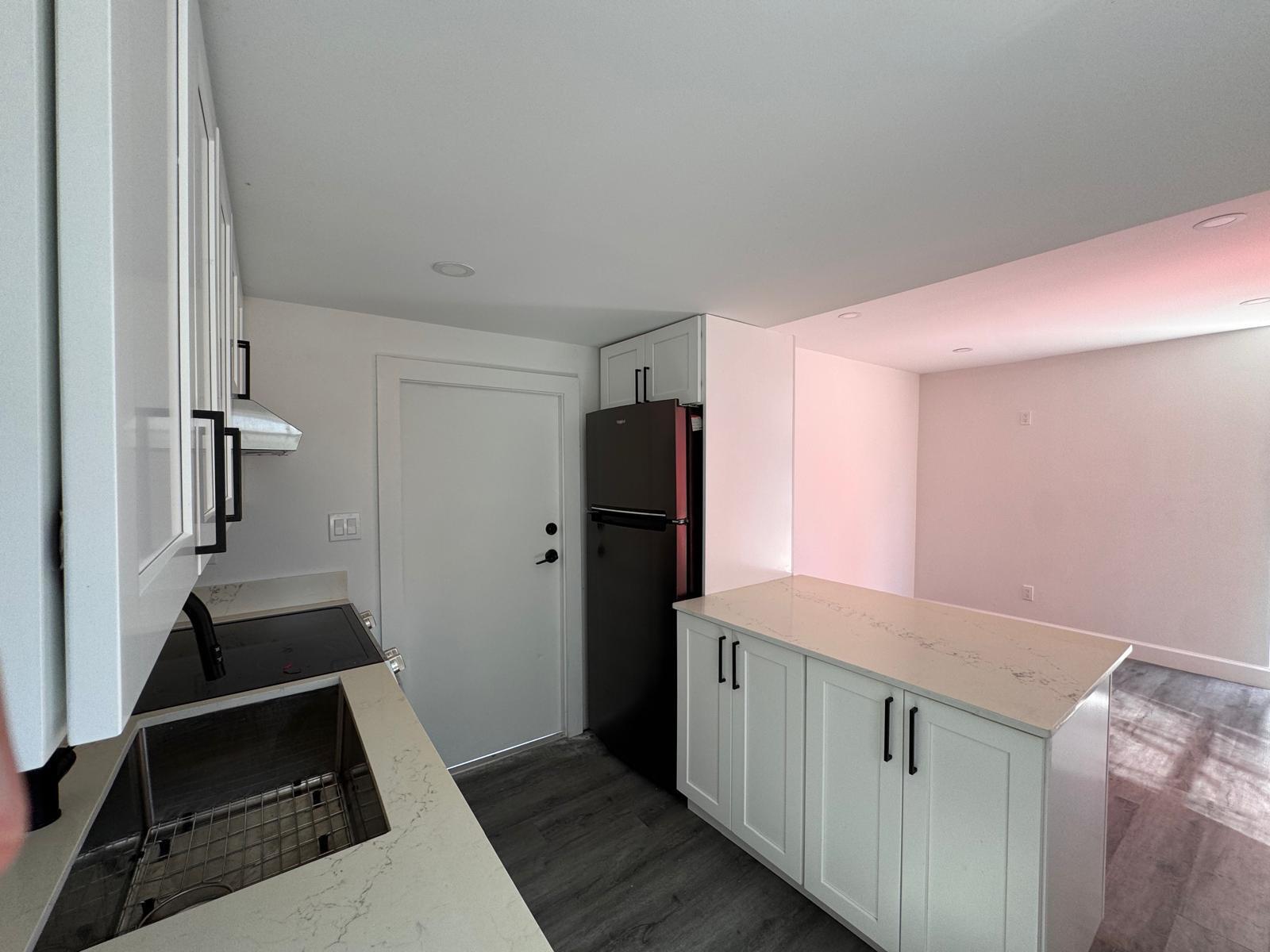 357 Hunting Club Avenue Clewiston, FL 33440 - Photo 5 of 37 a kitchen with cabinets and a stove