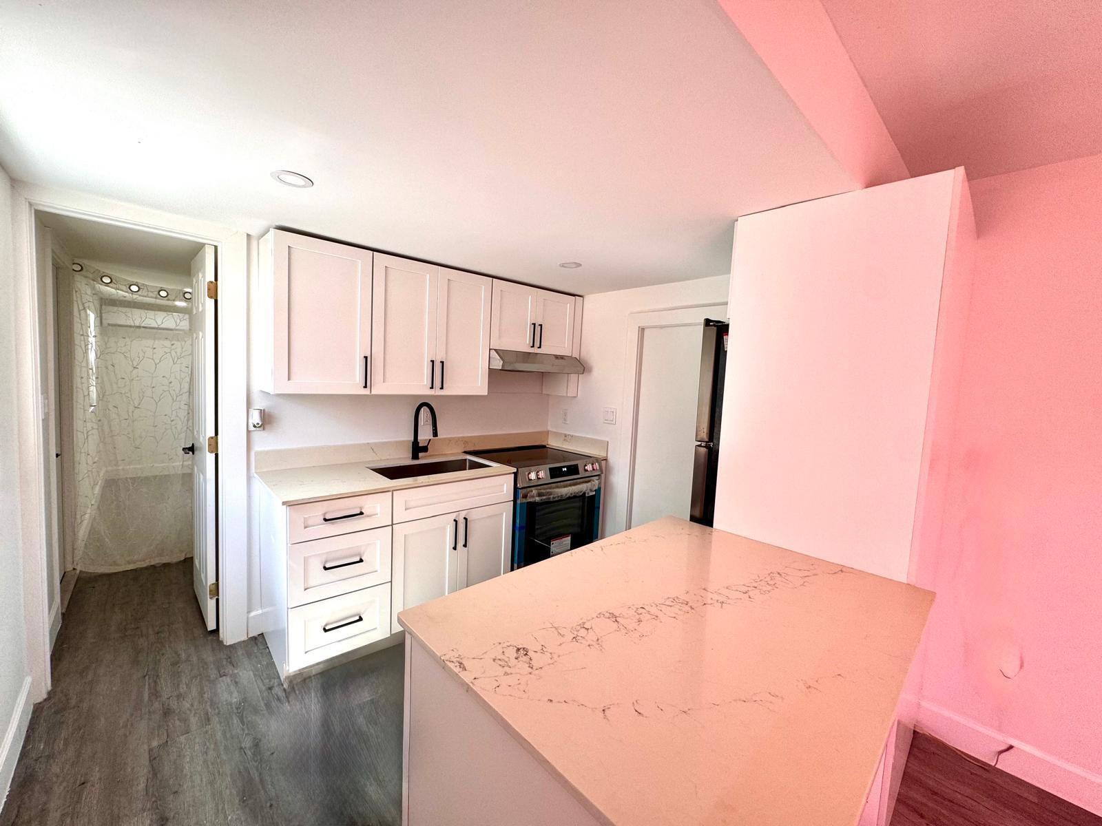 357 Hunting Club Avenue Clewiston, FL 33440 - Photo 7 of 37 a kitchen with stainless steel appliances a refrigerator and a stove top oven