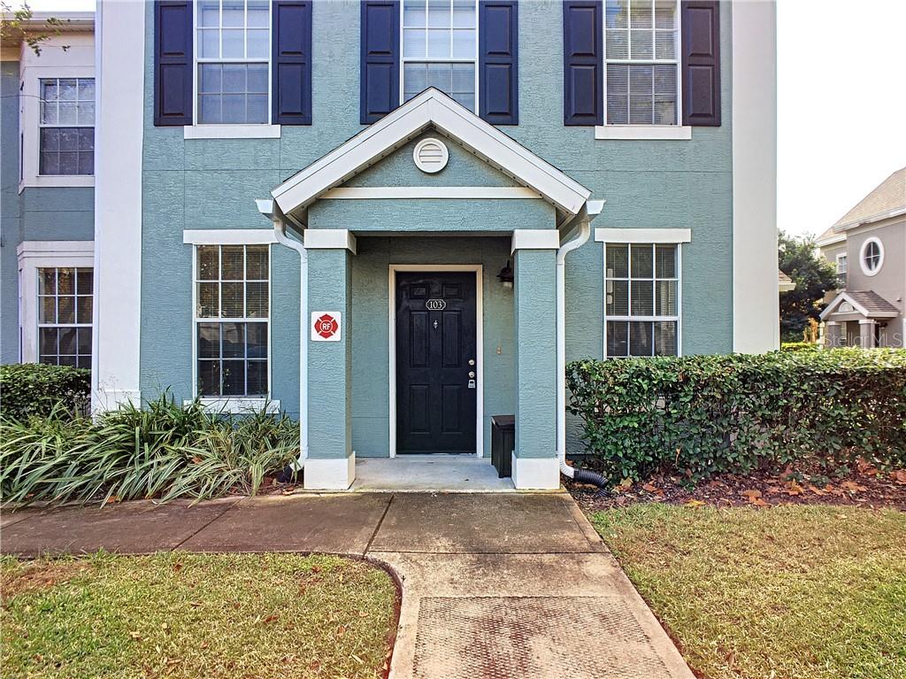 12824 Madison Pointe Circle, Unit 103 Orlando, FL 32821 - Photo 2 of 27 a front view of a house