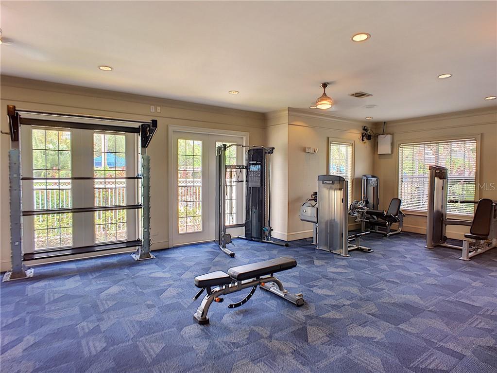 12824 Madison Pointe Circle, Unit 103 Orlando, FL 32821 - Photo 26 of 27 a view of a room with gym equipment