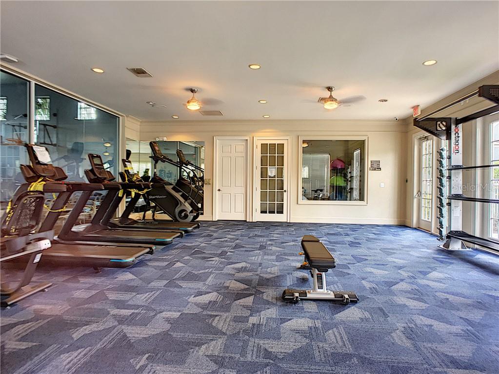 12824 Madison Pointe Circle, Unit 103 Orlando, FL 32821 - Photo 27 of 27 a view of a room with gym equipment