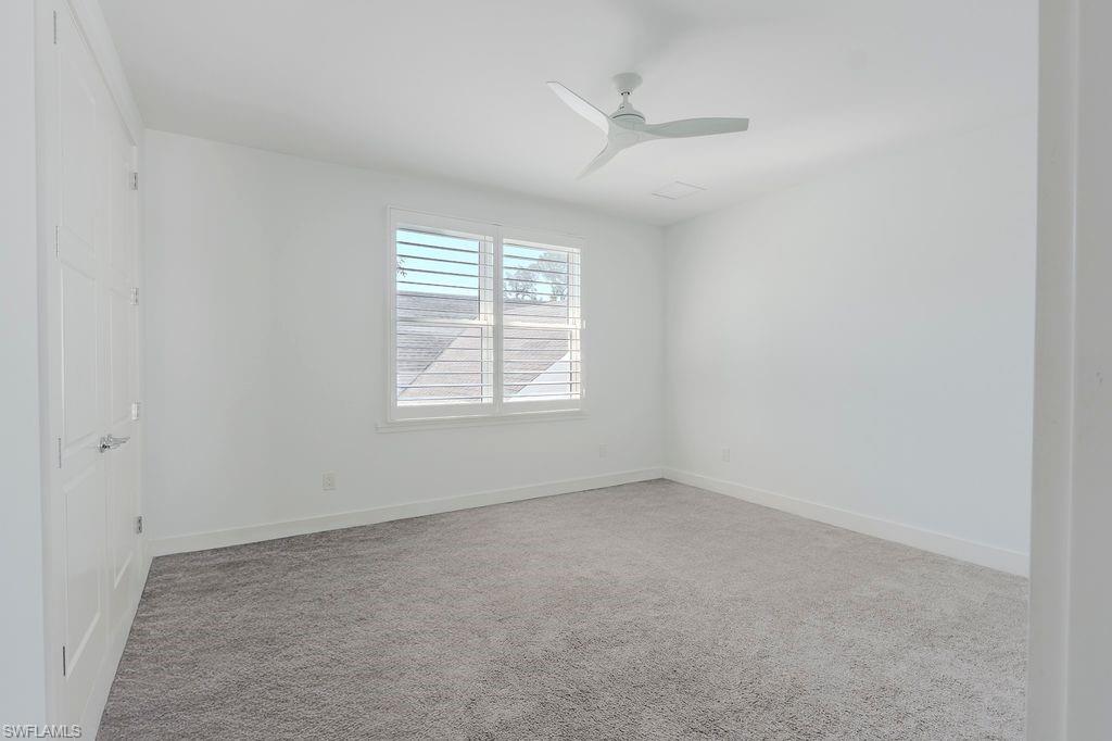 1075 Frank Whiteman Boulevard Naples, FL 34103 - Photo 33 of 43 Bedroom #2 over head fan and custom closet