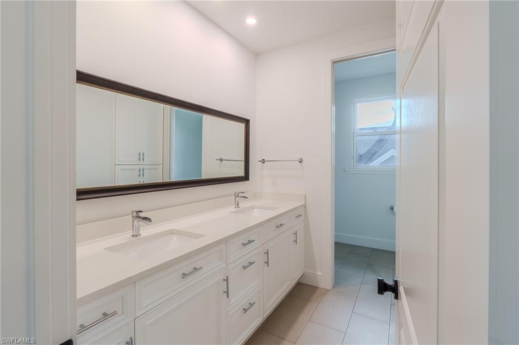 1075 Frank Whiteman Boulevard Naples, FL 34103 - Photo 35 of 43 Family bathroom - love the bath / tub divide !!!