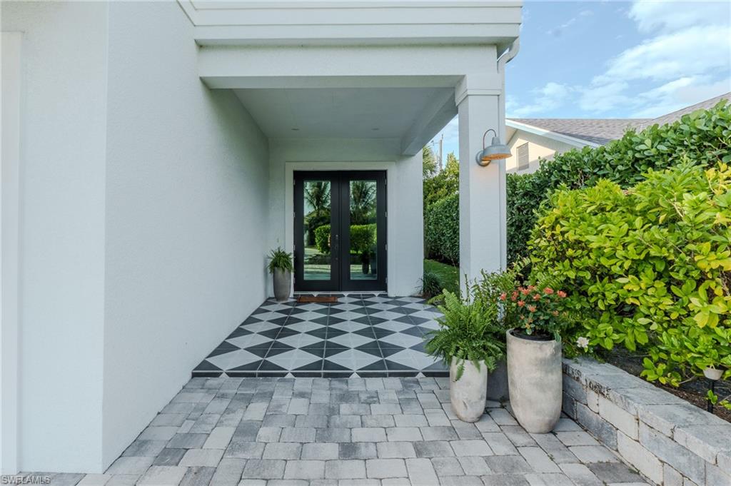 1075 Frank Whiteman Boulevard Naples, FL 34103 - Photo 4 of 43 Stylishly tiled entrance enhances that luxury feel