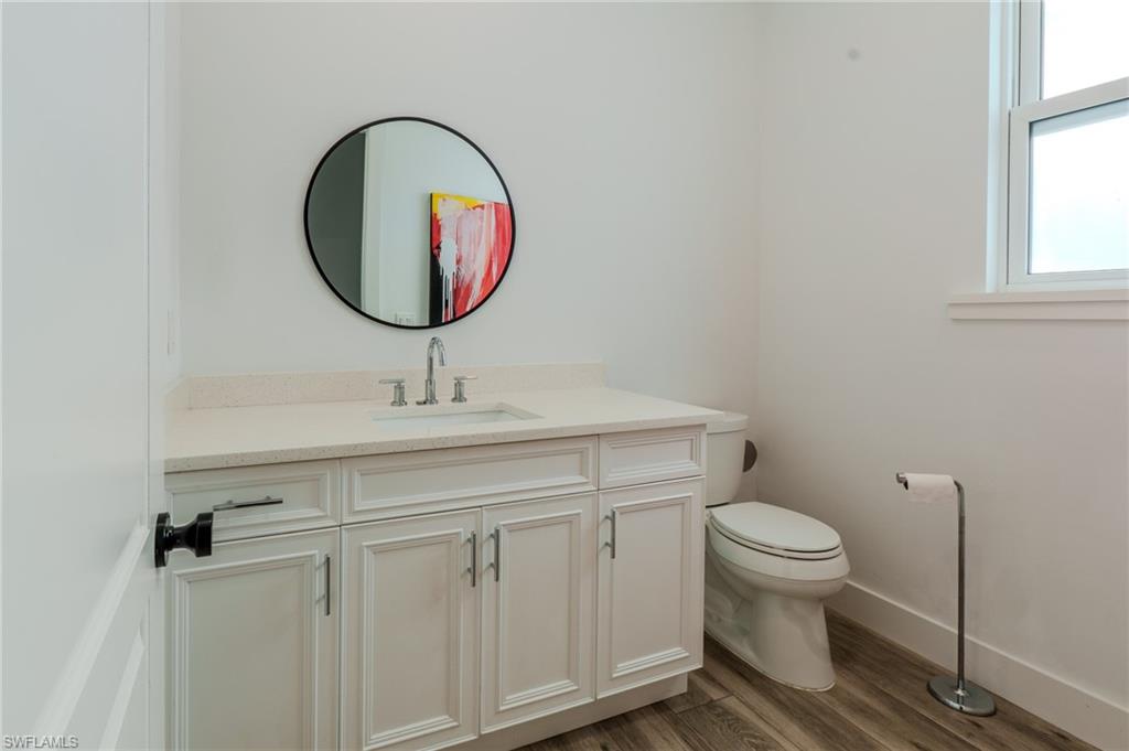 1075 Frank Whiteman Boulevard Naples, FL 34103 - Photo 7 of 43 So convenient - a main floor bathroom for your visiting guests' use.