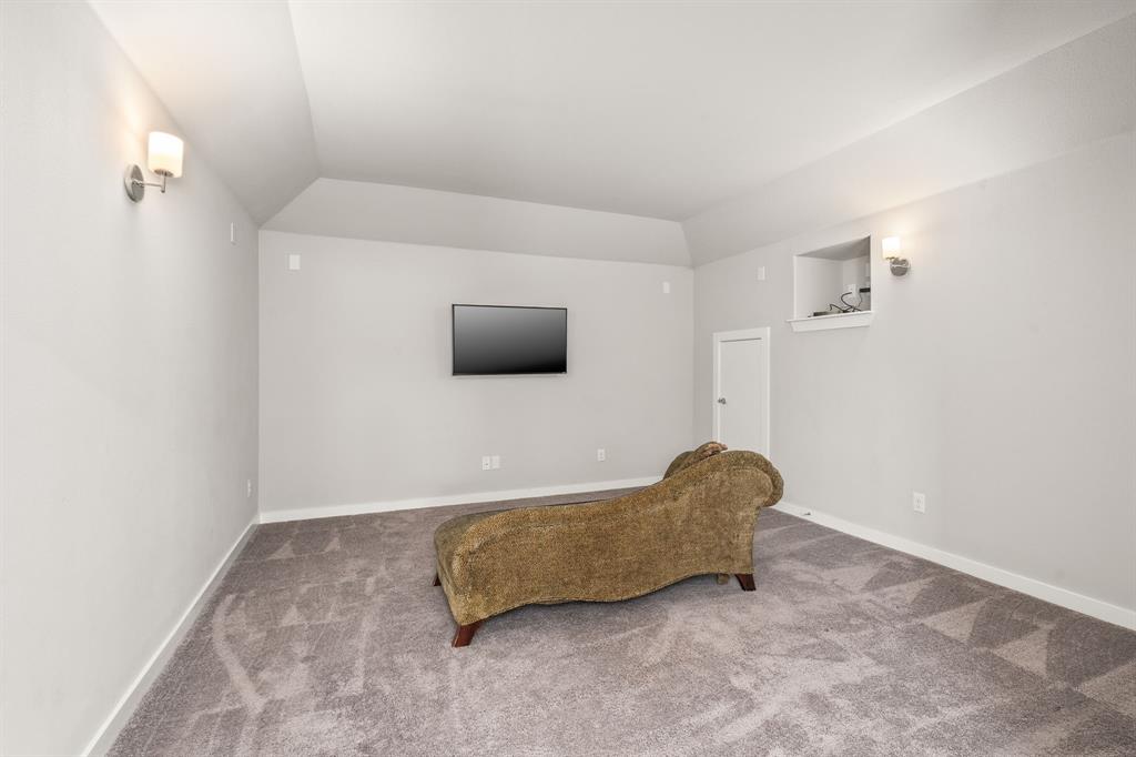 4017 Mapleleaf Pass Melissa, TX 75454 - Photo 21 of 32 a living room with a couch and a flat screen tv