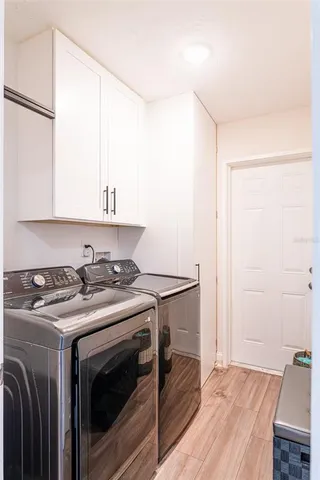a view of a sink and a stove in a kitchen
