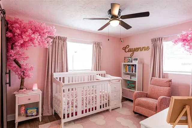 a bedroom with furniture and a window