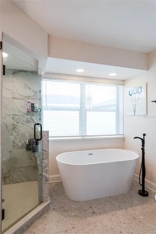 a white bath tub sitting in a bathroom