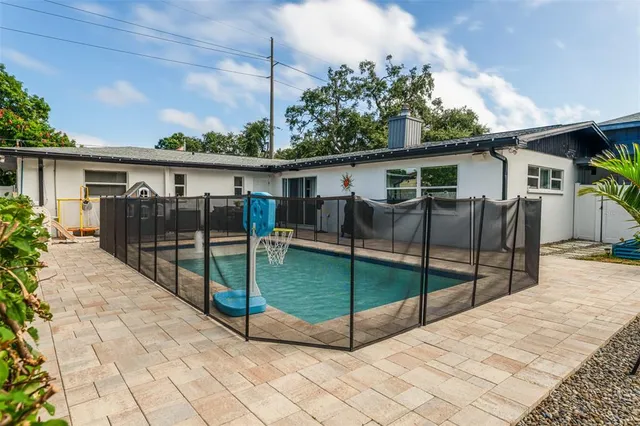 a view of backyard with cabin and wooden fence