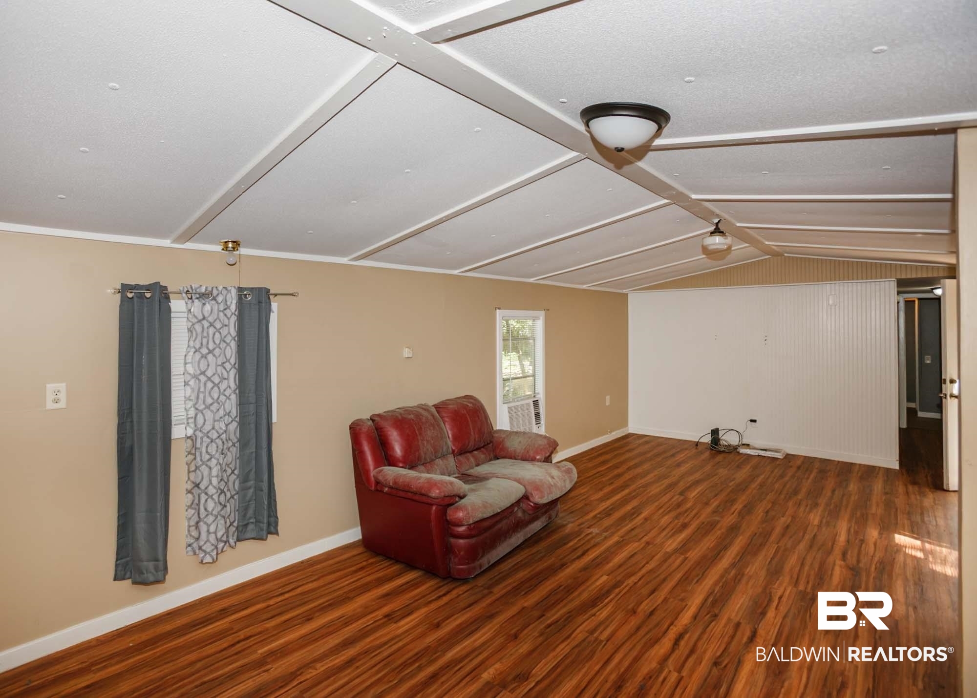 11998 Workman Avenue Foley, AL 36535 - Photo 39 of 59 Sitting room featuring wood finished floors and baseboards