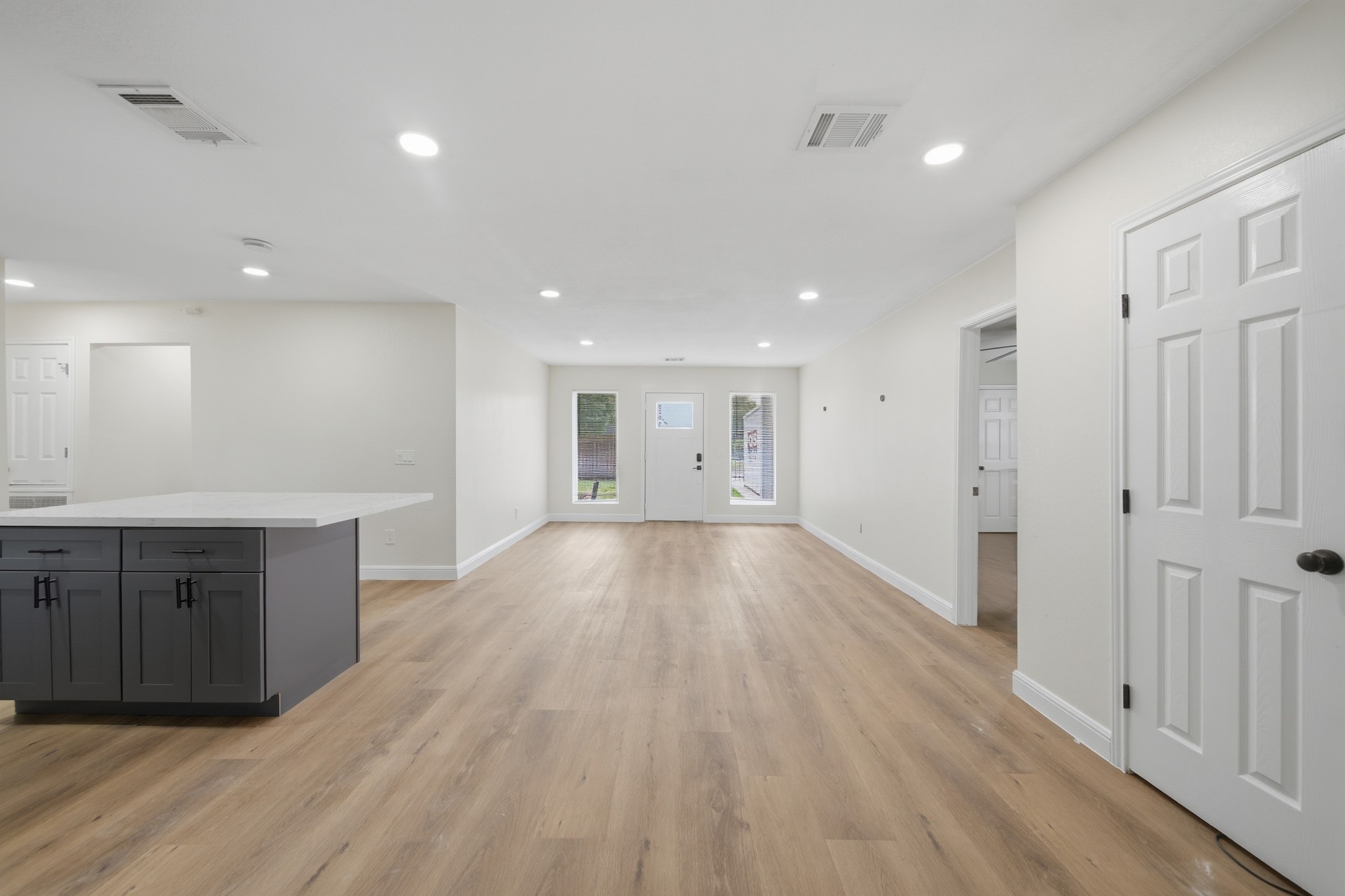 5207 Enyart Street Houston, TX 77021 - Photo 13 of 39 another angle of the open concept living and dining room, looking towards the front door