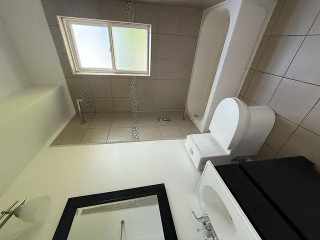 a kitchen with granite countertop stainless steel appliances a sink stove and microwave