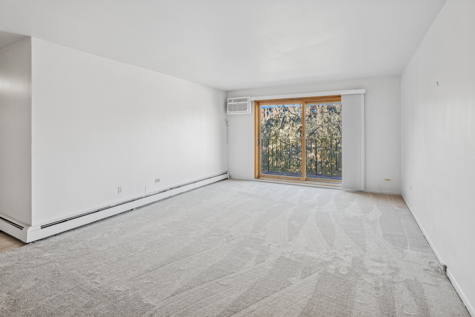 8905 Knight Avenue, Unit 211 Des Plaines, IL 60016 - Photo 11 of 24 an empty room with windows