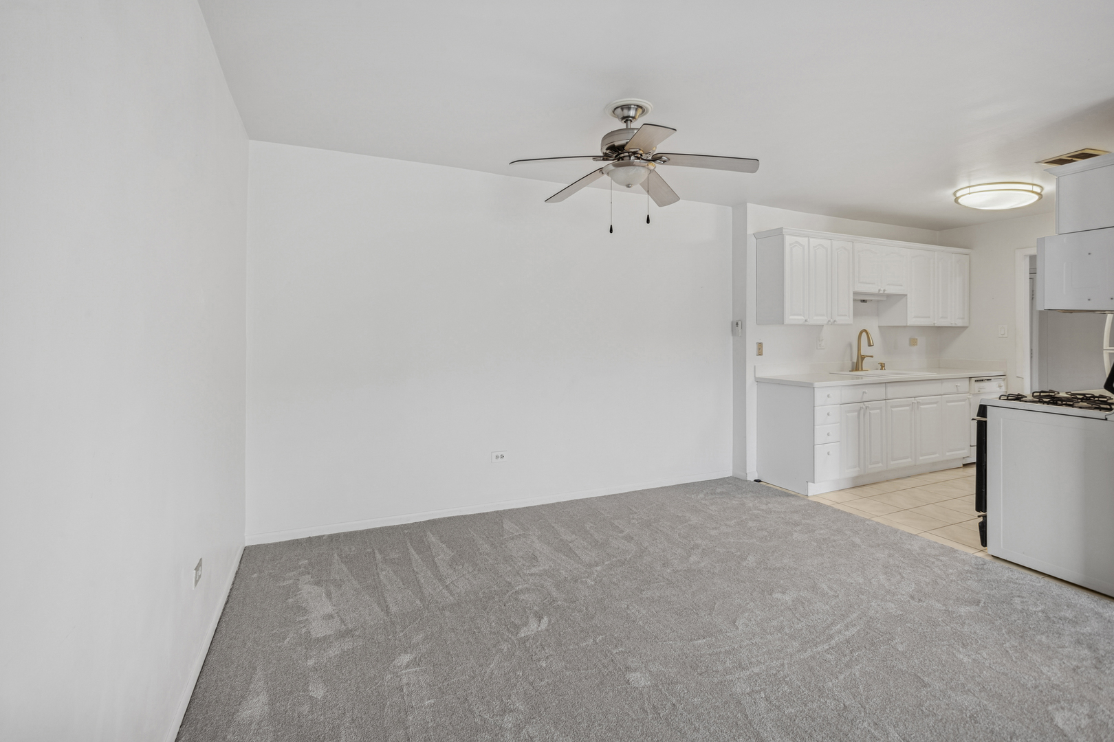 8905 Knight Avenue, Unit 211 Des Plaines, IL 60016 - Photo 12 of 24 a view of a kitchen with a sink and dishwasher