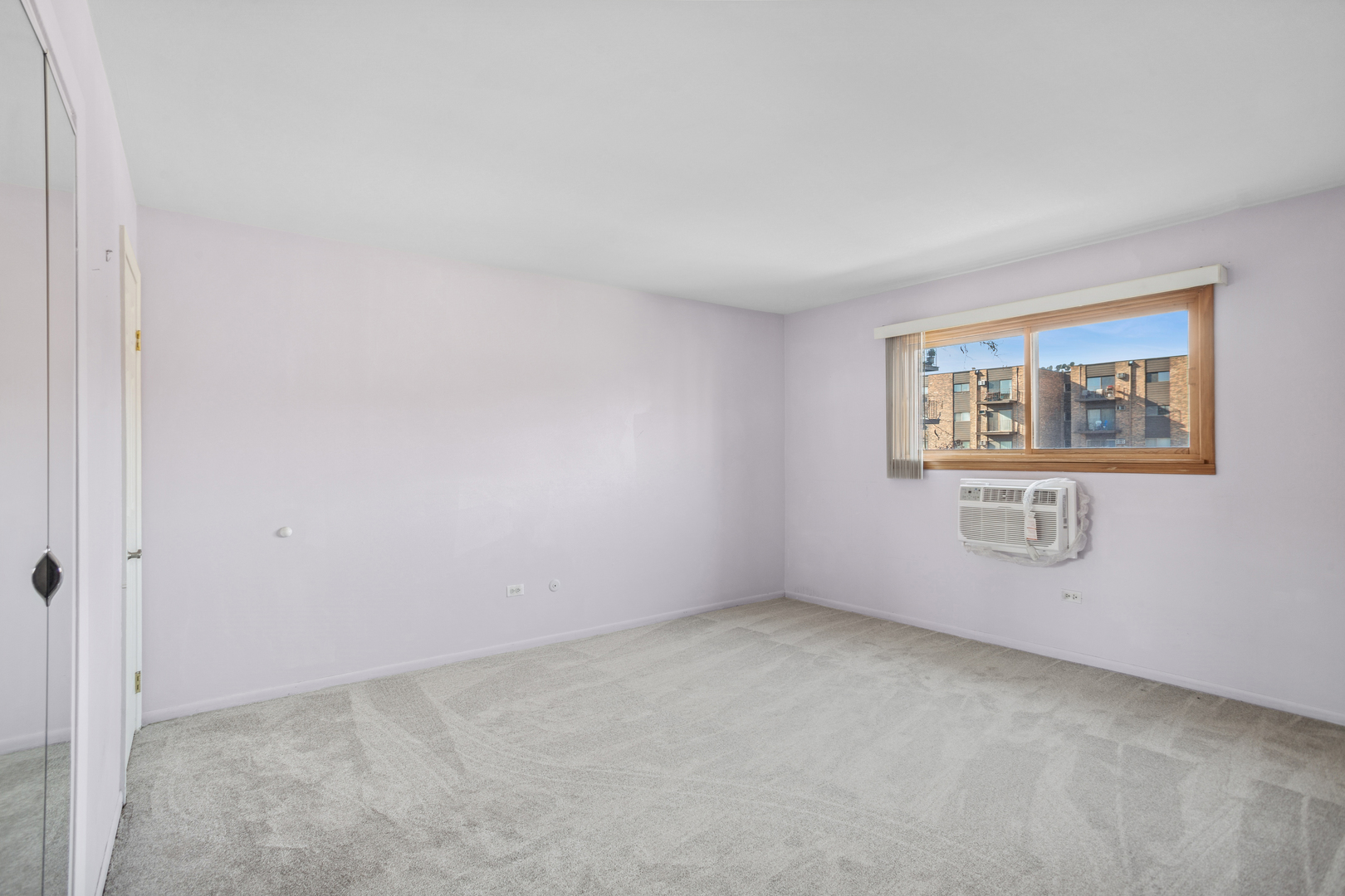 8905 Knight Avenue, Unit 211 Des Plaines, IL 60016 - Photo 16 of 24 a view of an empty room with a window