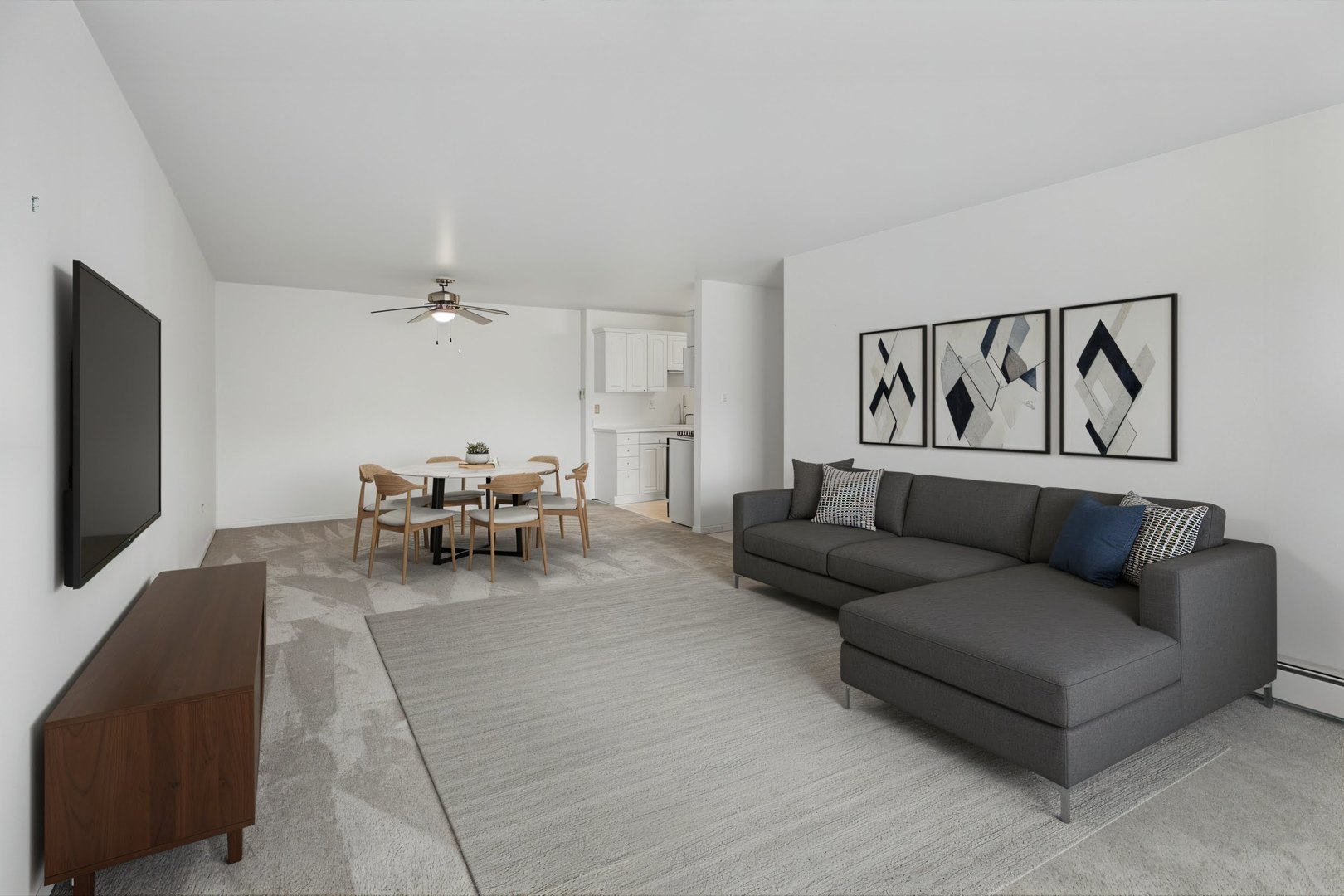 8905 Knight Avenue, Unit 211 Des Plaines, IL 60016 - Photo 10 of 24 a living room with furniture and a flat screen tv