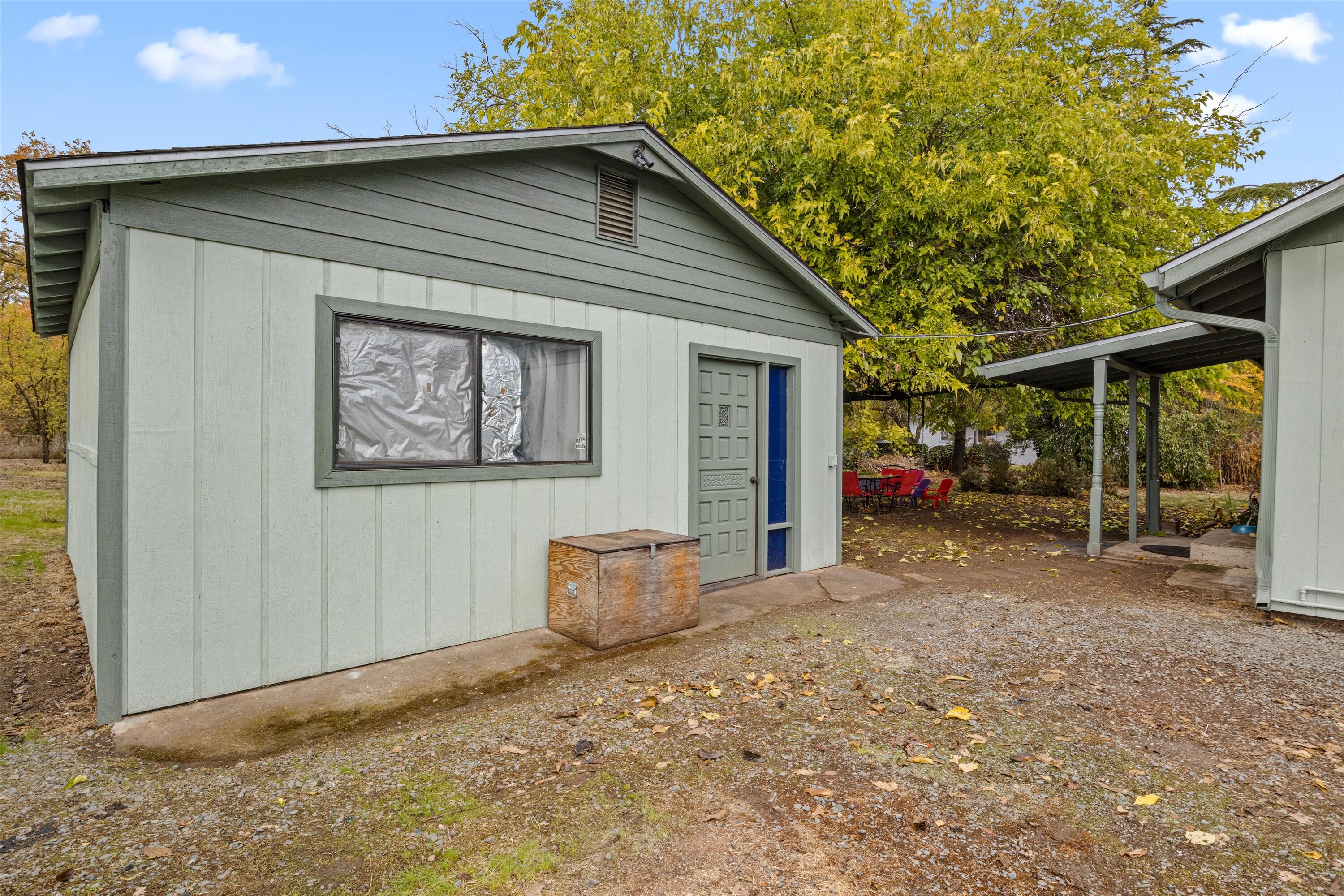 6355 Harold Road Central Point, OR 97502 - Photo 23 of 27 a backyard of a house with barbeque oven table and chairs