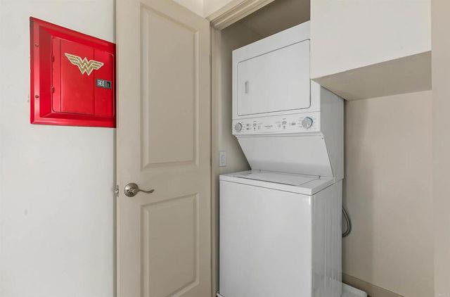 an aerial view of a house with a yard and lake view
