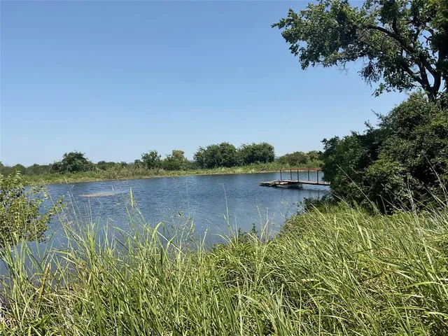 a view of lake with green space