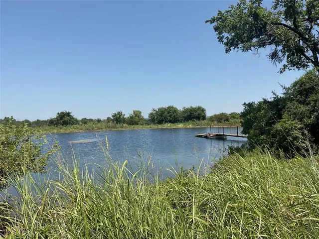 a view of lake with green space