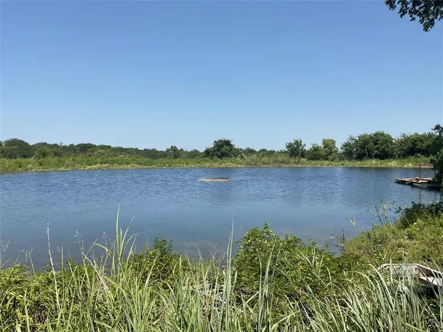 a view of a lake with a city